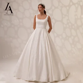 LelaAcra מבריק ללא שרוולים שמלת החתונה 2022 הצווארון המרובע, לבנות ויפות קו רכבת בית משפט נסיכה שמלות כלה SY60 Vestido de Noiva