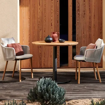 מרפסת חיצונית שולחן כיסא שילוב פנאי חיצוני קש הכיסא במרפסת המלון יצירתיים ריהוט גן